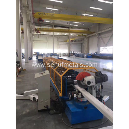 Auxiliary elbow machine for downpipe forming machine